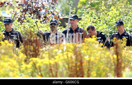 Police search 'Clover Fields' a wild flower meadow in the town of Soham, Cambridgeshire for clues on the disappearance of 10-year- old Jessica Chapman and Holly Wells. Scotland Yard detectives with experience of major incidents have been drafted in to help the search for the girls. Stock Photo