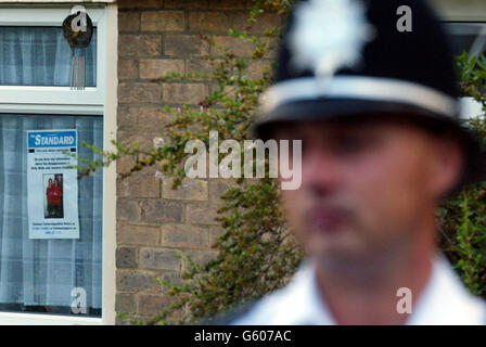 A police officer outside the home of caretaker Ian Huntley and his partner Maxine Carr in Soham, Cambs, following a press conference on missing 10-year-old girls Holly Wells and Jessica Chapman. * School caretaker Ian Huntley, 28, and Maxine Carr, 25, are being questioned about the disappearance of the two girls. Stock Photo