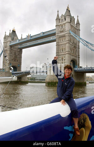 British Yachtswoman Tracy Edwards sits on her 110ft record-breaking yacht, Maiden II near London's Tower Bridge. Tracy and her crew will collect the World Speed Record trophy this week after sailing 694.78 nautical miles in 24 hours last month. * Edwards and her crew were stopped for speeding today - as their catamaran returned to London after breaking the 24-hour world speed record. The13-strong crew were caught breaking the 8 knot speed limit on the River Thames by a police boat. Stock Photo