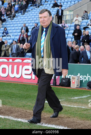 Former Coventry City player Alan Green steps on to the pitch at half ...