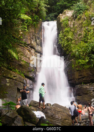 People enjoy cooling off in La Mina Falls, El Yunque Falls, Puerto RIco. Stock Photo