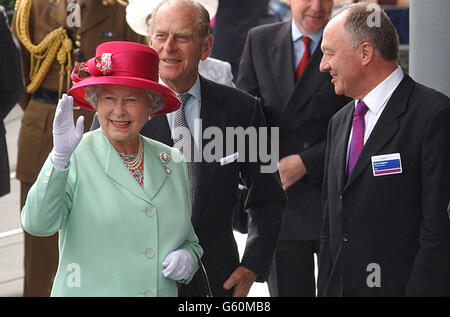 London's Mayor Ken Livingstone (right) greets Britain's Queen Elizabeth II and her husband, the Duke of Edinburgh, as they arrive to open City Hall, which houses the London Assembly, on the south bank of the Thames, close to Tower Bridge. *The stunning building, designed by Foster and Partners, and constructed by Arup & Partners, has an assembly chamber, committee rooms and public facilities, together with offices for the Mayor, London Assembly Members and staff of the Greater London Authority. It provides 185,000 sq ft (gross) of space onten levels that can accommodate 440 staff and members. Stock Photo