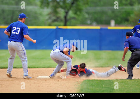 Base runner being tagged by opposing second baseman on an unsuccessful attempted steal of second. USA. Stock Photo