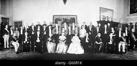 Members of the Dutch royal family and guests gather for a dinner held in honour of 18-year-old Princess Beatrix, at the Royal Palace in Amsterdam. On the front row are (l-r) Jonkheer F Beelaerts Van Blokland, Dr Willem Drees, JA Jonkman, Princess Wilhelmina, Queen Juliana, Princess Beatrix, Prince Bernhard, LG Kortenhorst, LJM Beel and Dr J Donner. Stock Photo