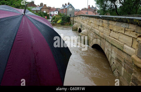 The floodwater rises in Thirsk, North Yorkshire after torrential rain left the area with severe flood warnings. Stock Photo