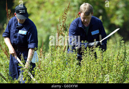 Police search teams outside the town of Soham, Cambridgeshire, in their hunt for clues about the missing 10 year olds Jessica Chapman and Holly Wells. Scotland Yard detectives with experience of major incidents have been drafted in to help the search for the girls. * A team of officers from the Serious Crime Group started work to conduct a thorough review of the progress of the investigation by the Cambridgeshire force at a time when detectives are still waiting for a breakthrough. Stock Photo