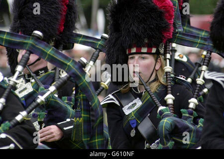 Scottish pipers play at the Lonach Gathering, in the village of Strathdon, Aberdeenshire. Guests at the traditional Highland games which dates back to the 19th Century, included Billy Connolly and former Monty Python star Eric Idle. Stock Photo