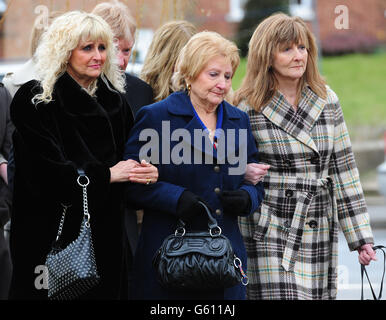 Lucy Collier (centre) widow of comedian Norman Collier arrives for his funeral service at St Helen's Church, Welton, Hull. Stock Photo