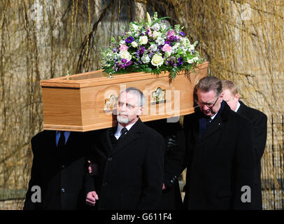 The coffin of comedian Norman Collier is carried out of church after his funeral service at St Helen's Church, Welton, Hull. Stock Photo