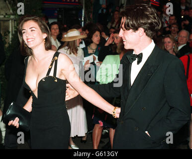 Actor Hugh Grant arrives with actress girlfriend Elizabeth Hurley for the chaity premiere of 'Four Weddings and a Funeral' in which he stars. Stock Photo