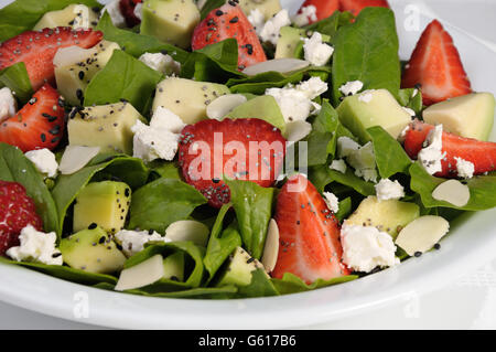 Salad spinach with strawberries, avocado,  ricotta and sesame,poppy seeds Stock Photo