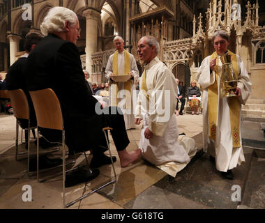 The Archbishop of Canterbury, The Most Reverend Justin Welby (middle) performs the Washing of the Feet ceremony during the Maundy Thursday Sung Eucharist service at Canterbury Cathedral, Kent. Stock Photo