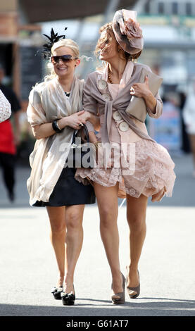 Ladies arrive for racing on the Grand Opening Day of the 2013 John Smith's Grand National Meeting at Aintree Racecourse, Sefton. Stock Photo
