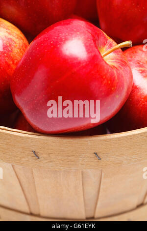 Close Up of an Apple in Basket Isolated on White Background. Stock Photo