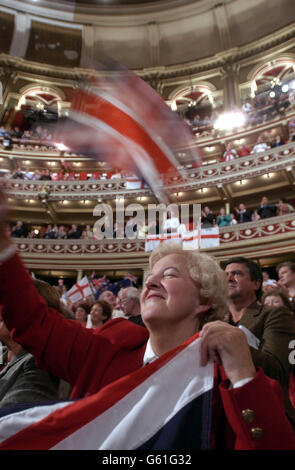 Marlene Burt from Bexley in Kent waves her flag as the BBC Orchestra plays 'Rule Britannia' as a finale at The Last Night of the Proms,in the Royal Albert Hall, London. Stock Photo