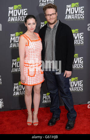 Seth Rogen and wife Lauren Miller arrive at The MTV Movie Awards 2013 at Sony Pictures Studios, Culver City, Los Angeles. Stock Photo