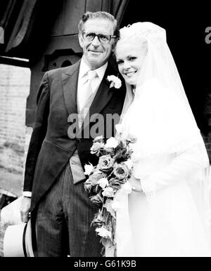 George Mitchell ,59, of Black and White Minstrel fame, with his bride, 30-year-old Dorothy Ogden - one of the show's singers - after their wedding at the St John the Baptist Church in Kingston. Stock Photo