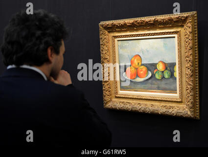 Paul Cezanne's 1889 - 90 painting Les Pommes, is displayed at Sotheby's auction house during the preview for New York Auctions of Impressionist, Modern and Contemporary Art At Sotheby's London. One quarter of a billion dollars of art will be auctioned by Sotheby's in New York on 7th -8th & 14th-15 May 2013. Stock Photo