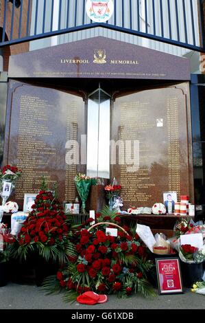 Flowers are left against the Hillsborough disaster memorial at Anfield, as thousands of people are expected to attend a memorial service today to mark the 24th anniversary of the Hillsborough disaster. Stock Photo