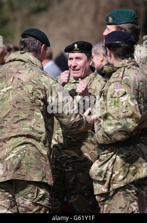 Musician Jools Holland (centre) in his role as Deputy Lord Lieutenant of Kent, talks to members of the Operation Herrick 17 Explosive Ordnance Disposal and Search Task Force, after they recieved their Afghanistan Campaign Medals at Invicta Park barracks in Maidstone, Kent, home to 36 Engineers Regiment (Search) which was the lead element in the task force. PRESS ASSOCIATION Photo. Picture date: Thursday April 18, 2013. Photo credit should read: Gareth Fuller/PA Wire Stock Photo