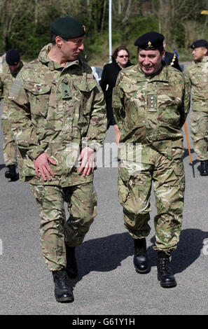 Musician Jools Holland (right) in his role as Deputy Lord Lieutenant of Kent, talks to Major General Tim Radford, General Officer Commanding Theatre Troops as members of the Operation Herrick 17 Explosive Ordnance Disposal and Search Task Force, after they received their Afghanistan Campaign Medals at Invicta Park barracks in Maidstone, Kent, home to 36 Engineers Regiment (Search) which was the lead element in the task force. PRESS ASSOCIATION Photo. Picture date: Thursday April 18, 2013. Photo credit should read: Gareth Fuller/PA Wire Stock Photo