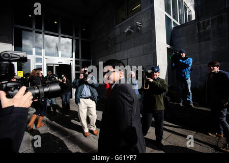 Praveen Halappanavar the husband of Savita Halappanavar walk past waiting photographers as he arrives for the inquest into her death at Galway Coroners court. Stock Photo