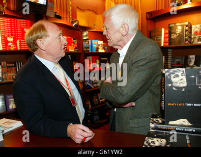 Former Labour leader Neil Kinnock (left) chats to Tony Booth - father of Cherie Blair, the Prime Minister's wife - at one of the Trade stalls at the Labour Party conference at Blackpool's Winter Gardens. Stock Photo