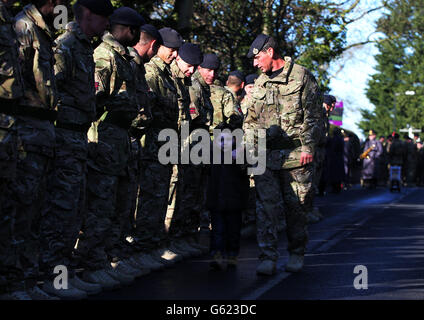 Troops from 21 Engineer Regiment are welcomed by their families in Ripon, North Yorkshire after returning home from Afghanistan. Stock Photo