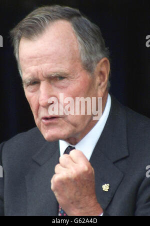 Former U.S. President George Bush gestures as he speaks of Iraq and the Desert Storm campaign during the rededication of the American Air Museum at the Duxford's Imperial War Museum, Cambridgeshire. Stock Photo