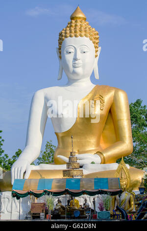 Giant, 17-metre Buddha tall at Wat Phra That Doi Kham (Temple of the Golden Mountain), a Buddhist temple in Chiang Mai, Thailand Stock Photo