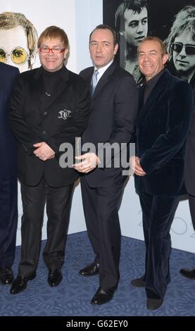 Sir Elton John (left), Kevin Spacey (centre) and Elton's songwriting partner Bernie Taupin pose for photographers as they arrive at the Music Industry Trust's Awards and Dinner 2002 at Le Meridien Grosvenor House, Park Lane in London. * Elton and Bernie are to be honoured at the 11th annual awards presentation organised by the British Phonographic Industry (BPI). Stock Photo