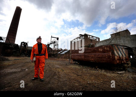 John Kane former miner and now guide, at the National Mining Museum for Scotland at the Lady Victoria Colliery in Newtongrange, stands at the old pithead as he reflects on the death of former Prime Minister Baroness Thatcher. Stock Photo