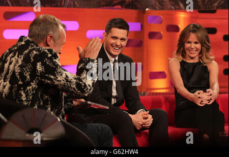 Presenter Graham Norton (left) with guests Michael Buble and Amanda Holden during filming of The Graham Norton Show, at The London Studios, south London, to be aired on BBC One on Friday evening. Stock Photo