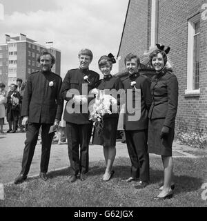 A group picture of The Joystrings, the Salvation Army Pop Group, after Sylvia Gair, the group's singer, married the band's guitarist Peter Dalziel at St Edwards Parish Church, New Addington, Surrey. (From left) drummer Wycliffe Noble, Peter Dalziel, Sylvia Gair, guitarist Captain Bill Davidson and vocalist Captain Joy Webb. Stock Photo