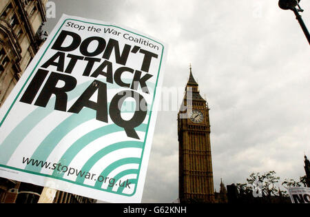 A placard is held aloft by a protester during the Stop The War Coalition Don't Attack Iraq demonstration in central London. The streets surrounding Embankment are jammed full for blocks in every direction. * The protesters are opposing proposed military action against Iraq by US President George Bush and British Prime Minister Tony Blair. Organiser Andrew Burgin said the two world leaders had used allegations that Iraqi leader Saddam Hussein has weapons of mass destruction as an excuse to fight a war that was about getting a more generous deal on oil in the region. Stock Photo