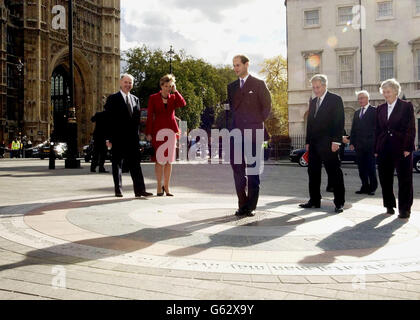 The Earl (centre) and Countess (second left) of Wessex joined by chairman of the House of Commons Works of Art Committee, Tony Banks (third right) in the Old Palace Yard outside Westminster, * receiving an ornate sundial on behalf of the Queen, who approved its design when she visited Westminster in April this year. The granite and bronze time keeper is a joint present from both Houses of Parliament to honour the Queen's five decades on the throne. Stock Photo