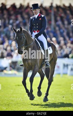 Great Britain's Kristina Cook in action during the dressage on her horse Miners Frolic during day three of the Badminton Horse Trials in Badminton, Gloucestershire. Stock Photo