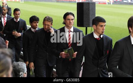 Liverpool players arrive for the Hillsborough disaster memorial service, at Anfield, marking the 24th anniversary of the disaster, as they remember the 96 Liverpool supporters who died in a crush at Sheffield Wednesday's Hillsborough stadium on April 15 1989, where Liverpool were to meet Nottingham Forest in an FA Cup semi-final. Stock Photo