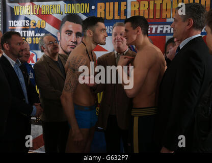 Welsh boxer Nathan Cleverly faces his challenger Robert Krasniqi (right) during the weigh in at Wembley Arena, London. Stock Photo