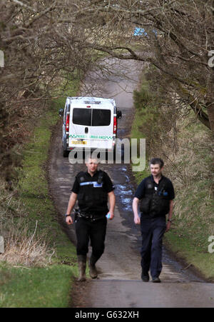 A private ambulance arrives in woodland above Bridge of Allan, Central Scotland, after police searching for a student missing since January, found a body in woodland yesterday. Stock Photo