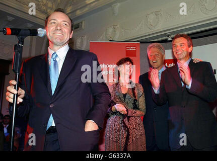 Hollywood star Kevin Spacey jokes during Britain's Prime Minister, Tony Blair's reception at the Labour party conference in Blackpool, they are joined by former United States President Bill Clinton, (2nd right). * Mr Clinton is scheduled to address the annual Labour Party Conference, at Blackpool, tomorrow, Wednesday. Stock Photo