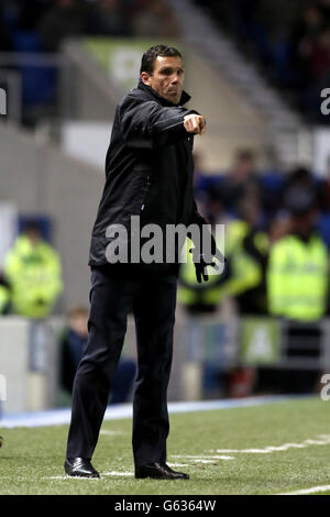 Soccer - npower Football League Championship - Brighton and Hove Albion v Charlton Athletic - AMEX Stadium. Brighton and Hove Albion manager Gus Poyet gestures on the touchline Stock Photo