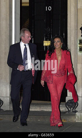 England football manager Sven Goran Eriksson and his partner Nancy Dell'Olio (right) leave 10 Downing Street. Members of the squad and their partners arrived at No 10 Downing Street for a reception to celebrate their achievements. * The procession of players was led by coach Sven Goran Eriksson and team captain David Beckham who were in deep conversation as they entered the Prime Minister's official residence. 03/06/03 : Nancy has told for the first time how she forgave him for his affair with TV presenter Ulrika Jonsson it was announced. Dell'Olio claimed the England football manager's fling Stock Photo