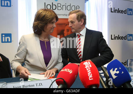 Taoiseach Enda Kenny and Minister for Social Protection Joan Burton launch an independent evaluation of JobBridge in LinkedIn's offices in Gardner House, Wilton Place. Stock Photo