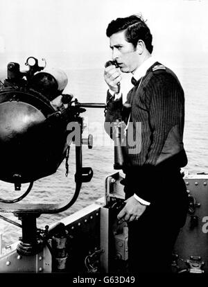 The Prince of Wales, issuing orders aboard his ship, HMS Bronington, the coastal minesweeper off the coast of Scotland, November 1, 1976. * The Prince of Wales today met Kevin Boyle, 41, who worked alongside him on HMS Bronington, during a visit to The Big House, a second-stage house for the homeless in south London, Friday October 11, 2002. Boyle is a resident of The Big House after falling on hard times. Stock Photo