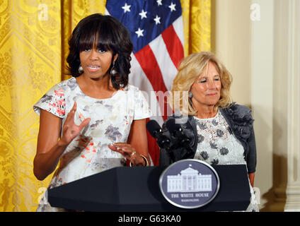 First Lady Michelle Obama with Dr Jill Biden (right) introduces Prince Harry during a visit to the White House. Stock Photo