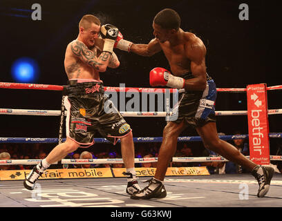 Ricky Burns (right) in action against Jose Gonzalez during the WBO Lightweight bout at the Emirates Arena, Glasgow. Stock Photo