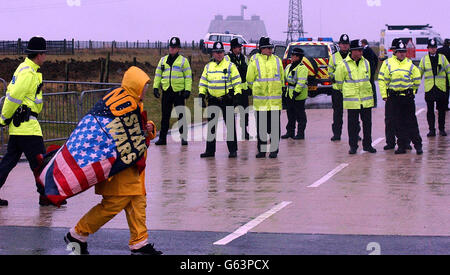 A CND protestor at the RAF Fylingdales Base on the North York Moors, where American Lt General Kadish was visiting. The protest is being held because CND campaigners think the base is being used for the controversial Star Wars program. * Despite the freezing cold conditions and torrential rain over 30 demonstrators wrapped up in waterproofs and thermals made their views clear by waving banners,props and placards. One stated: 'US Space Command, Killers, Cowards, Criminal Creeps, Hands Off Flyingdale.' Stock Photo