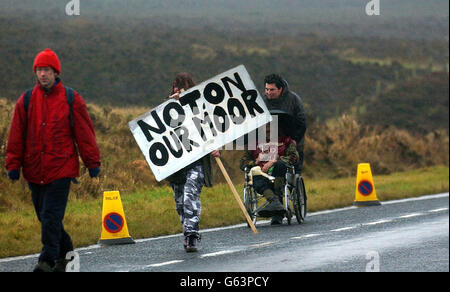 CND protestors make their way to the RAF Fylingdales Base on the North York Moors, where American Lt General Kadish was visiting. The protest is being held because CND campaigners think the base is being used for the controversial Star Wars program. * Despite the freezing cold conditions and torrential rain over 30 demonstrators wrapped up in waterproofs and thermals made their views clear by waving banners,props and placards. One stated: 'US Space Command, Killers, Cowards, Criminal Creeps, Hands Off Flyingdale.' Stock Photo