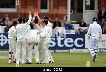 New Zealand's Neil Wagner is congratulated after England's Graeme Swann (right) is caught behind for 5 during the first test at Lord's Cricket Ground, London. Stock Photo